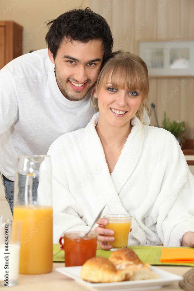 Couple having breakfast in the kitchen Couple having breakfast in the kitchen