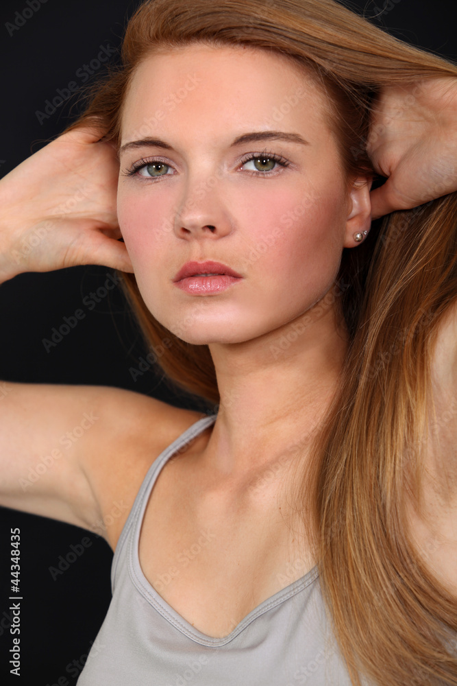 Model running hands through hair Model running hands through hair