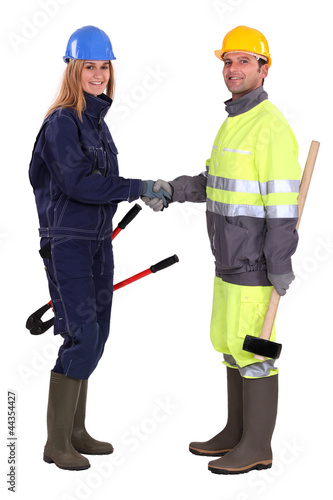 Construction workers shaking hands © auremar