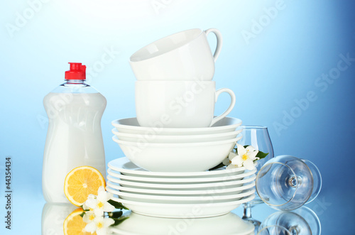 empty clean plates, glasses and cups with dishwashing liquid © Africa Studio