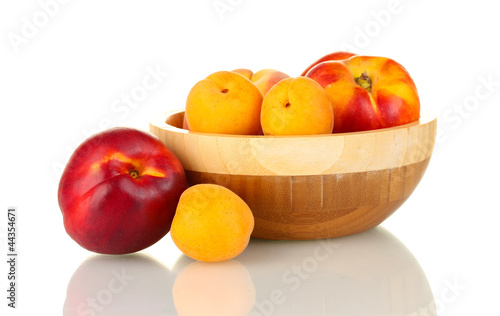 Ripe fruit in bowl isolated on white
