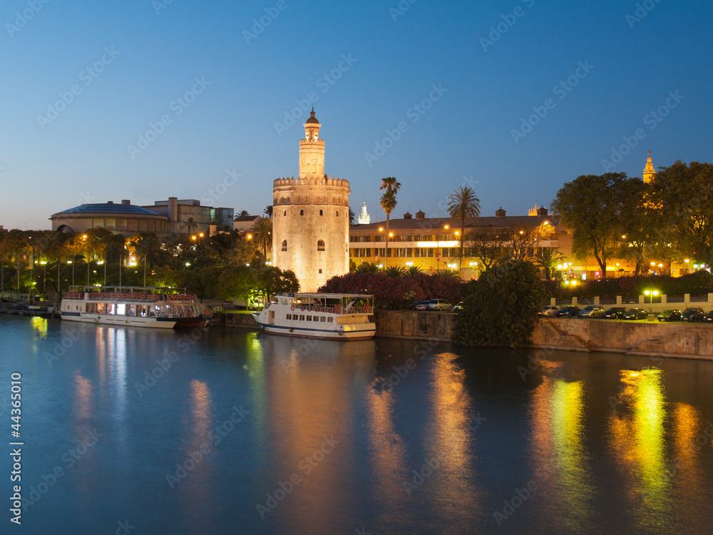 view of Golden Tower (Torre del Oro) of Seville, Spain over rive