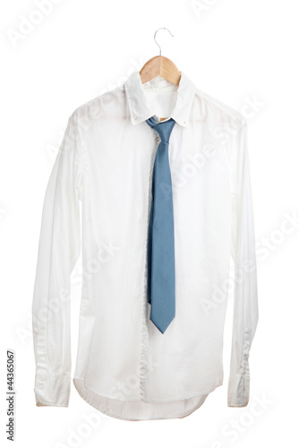 shirt with tie on wooden hanger isolated on white