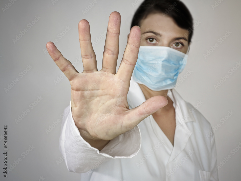 doctor with stop gesture - grey background doctor with stop gesture - grey background