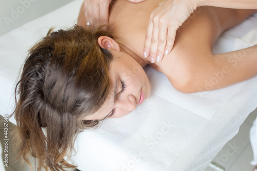 Young woman having a massage photo