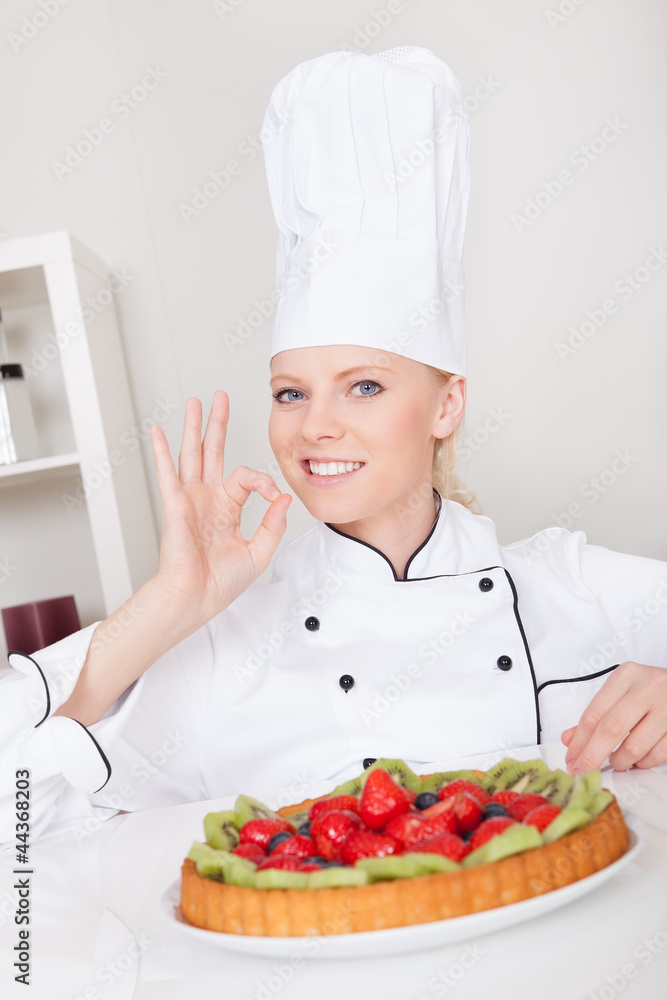 Beautiful chef woman making cake Beautiful chef woman making cake