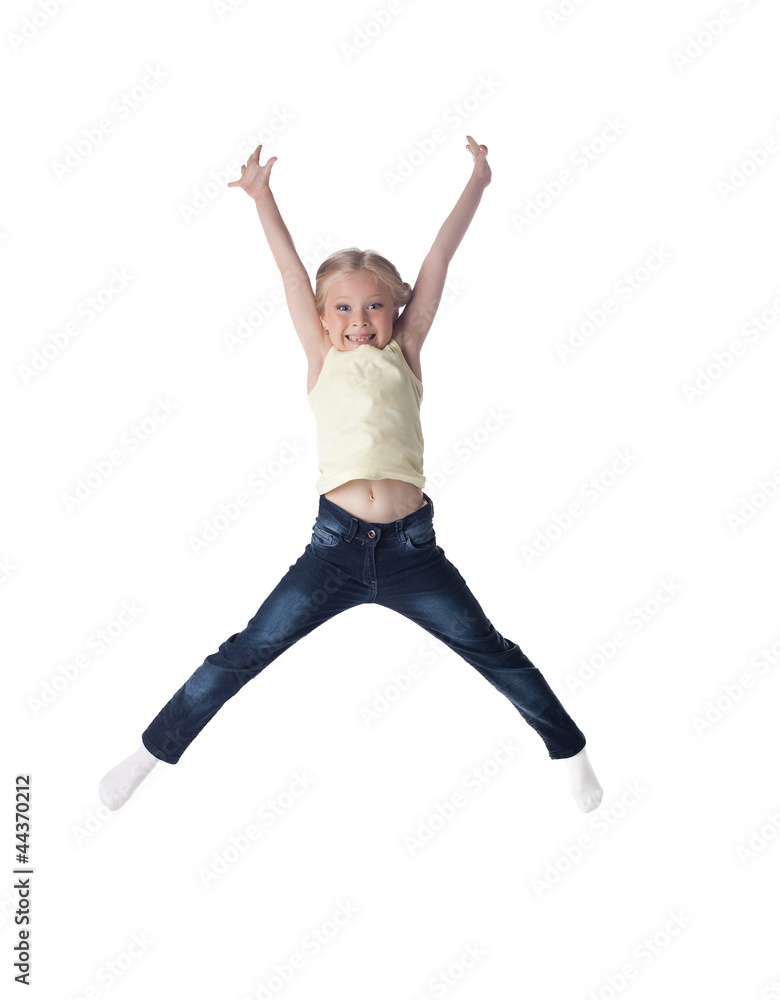 Happy blonde girl in jeans jumping