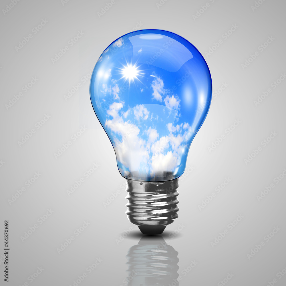 Electric light bulb and blue sky inside it Electric light bulb and blue sky inside it