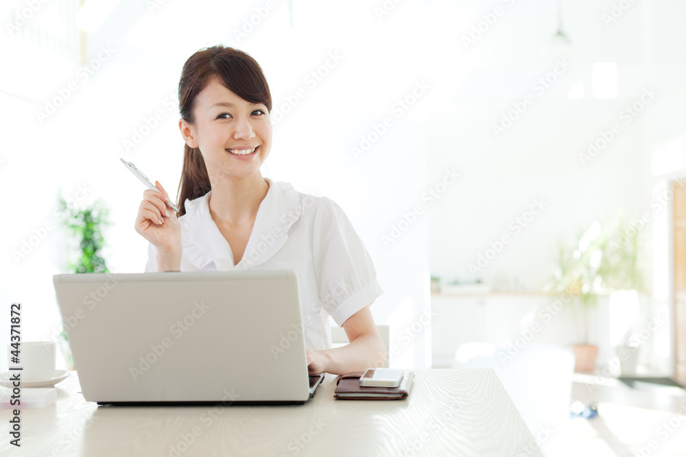 Beautiful business woman using a laptop computer. Portrait of as Beautiful business woman using a laptop computer. Portrait of as