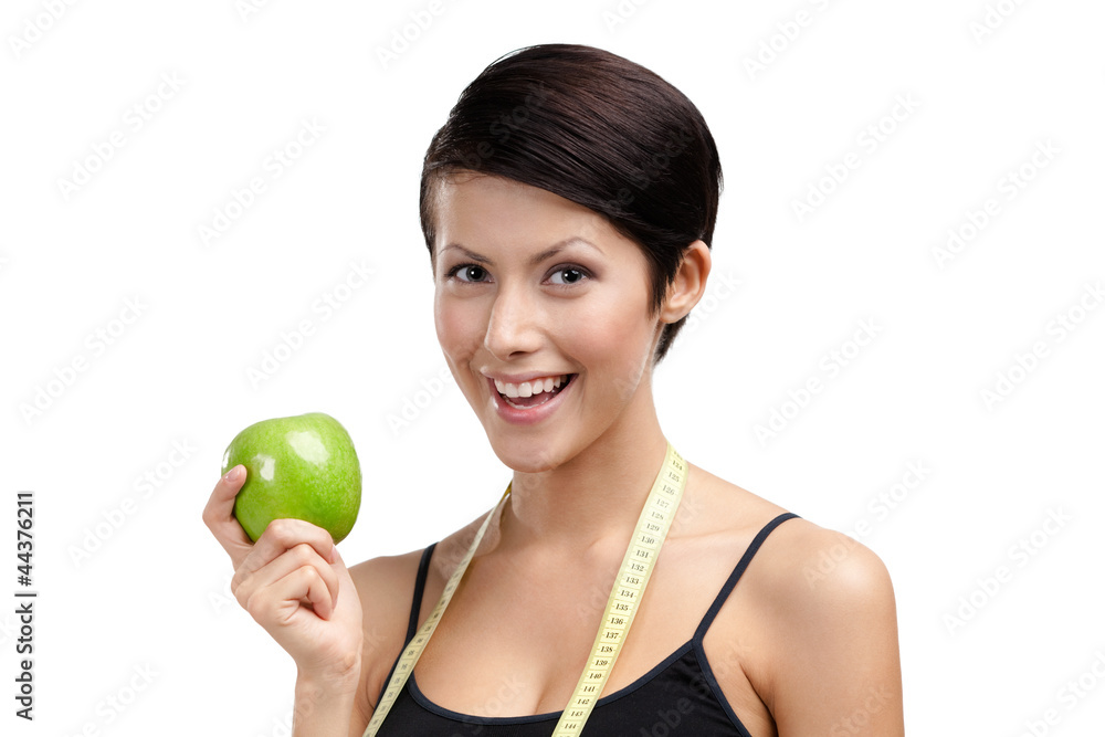 Girl with flexible ruler and green ripe apple, isolated on white Girl with flexible ruler and green ripe apple, isolated on white