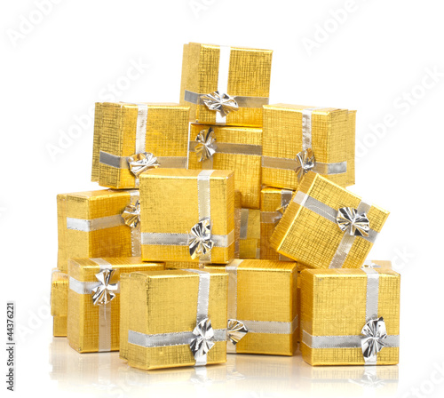 Top view of towel of gold gift boxes