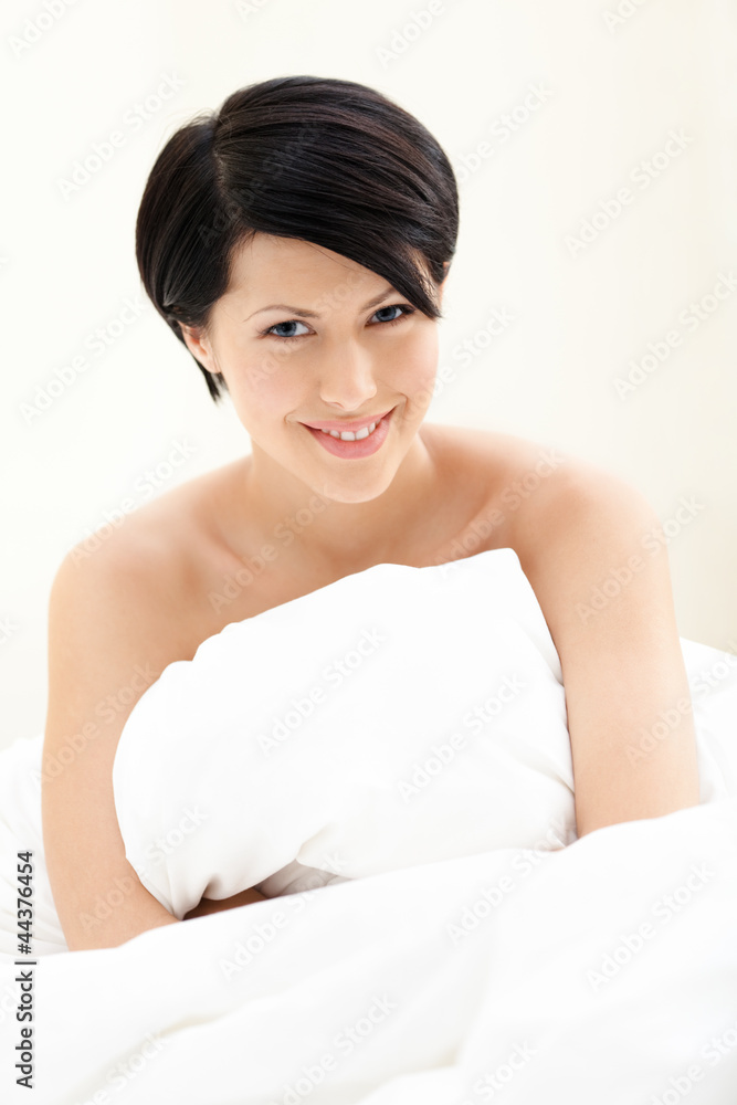 Halfnaked woman hugs the blanket, isolated on white background Halfnaked woman hugs the blanket, isolated on white background