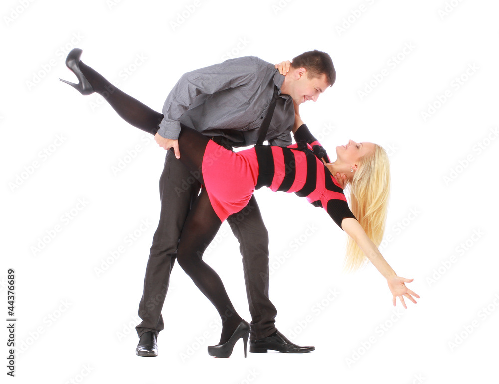 Young couple in business clothes on dancing pose