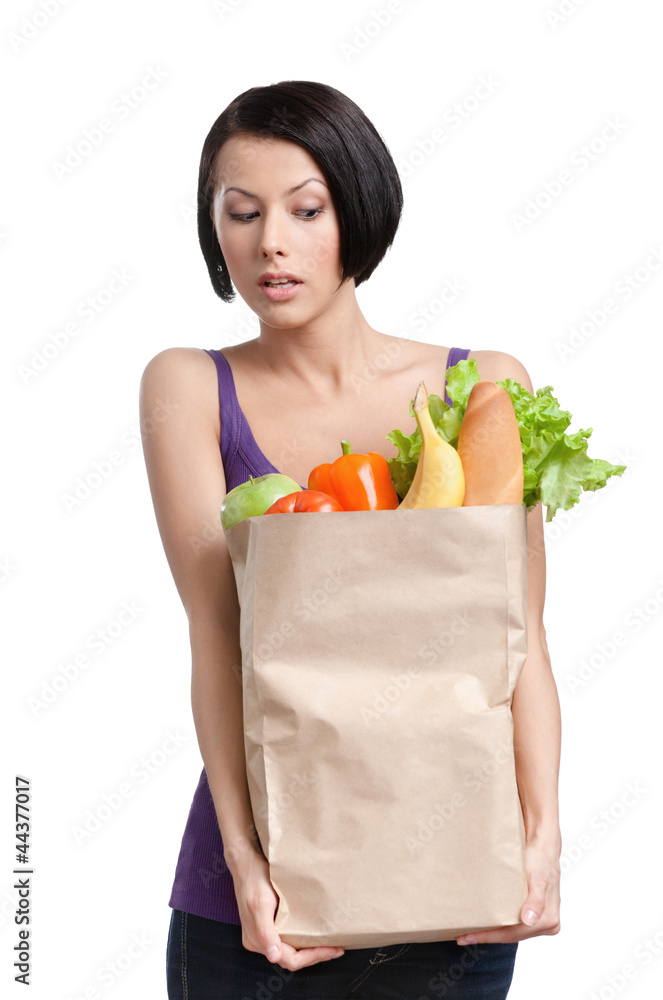 Attractive girl with the packet of vegetables, Isolated Attractive girl with the packet of vegetables, Isolated