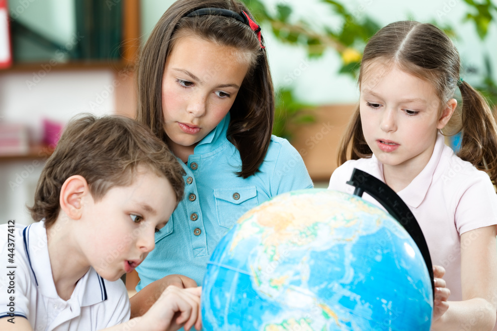 Pupils stare at the school terrestrial globe Pupils stare at the school terrestrial globe