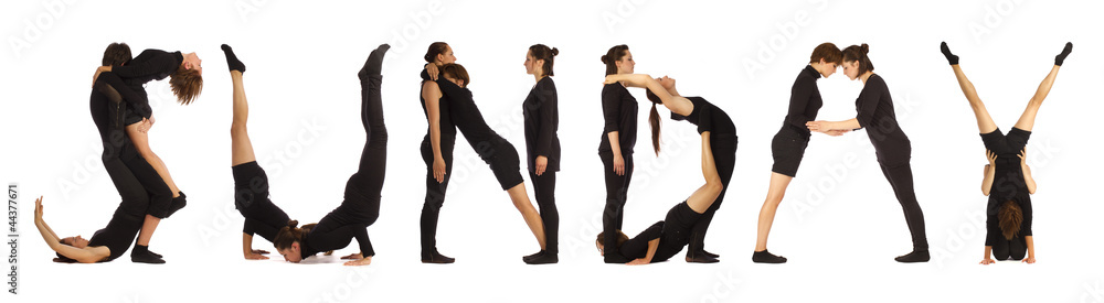 Black dressed people forming SUNDAY word over white Black dressed people forming SUNDAY word over white