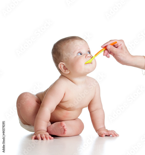 Little baby feeding with a ...
