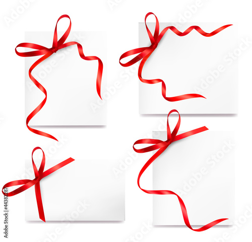 Collection of cards with red gift bows with ribbons