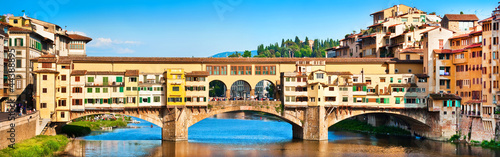 Panoramic view of Ponte Vecchio at sunset in Florence, Italy