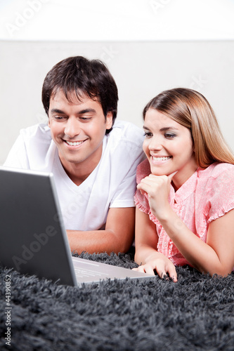 Young Couple Using Laptop