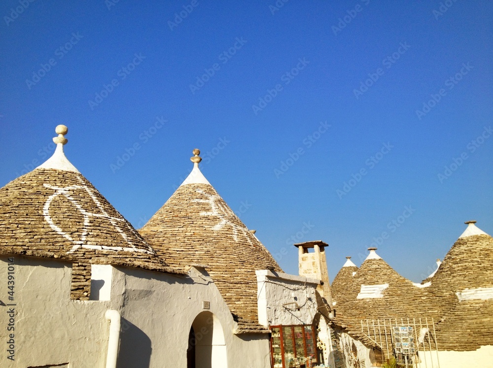 Typical trulli houses with conical roof in Alberobello, Italy