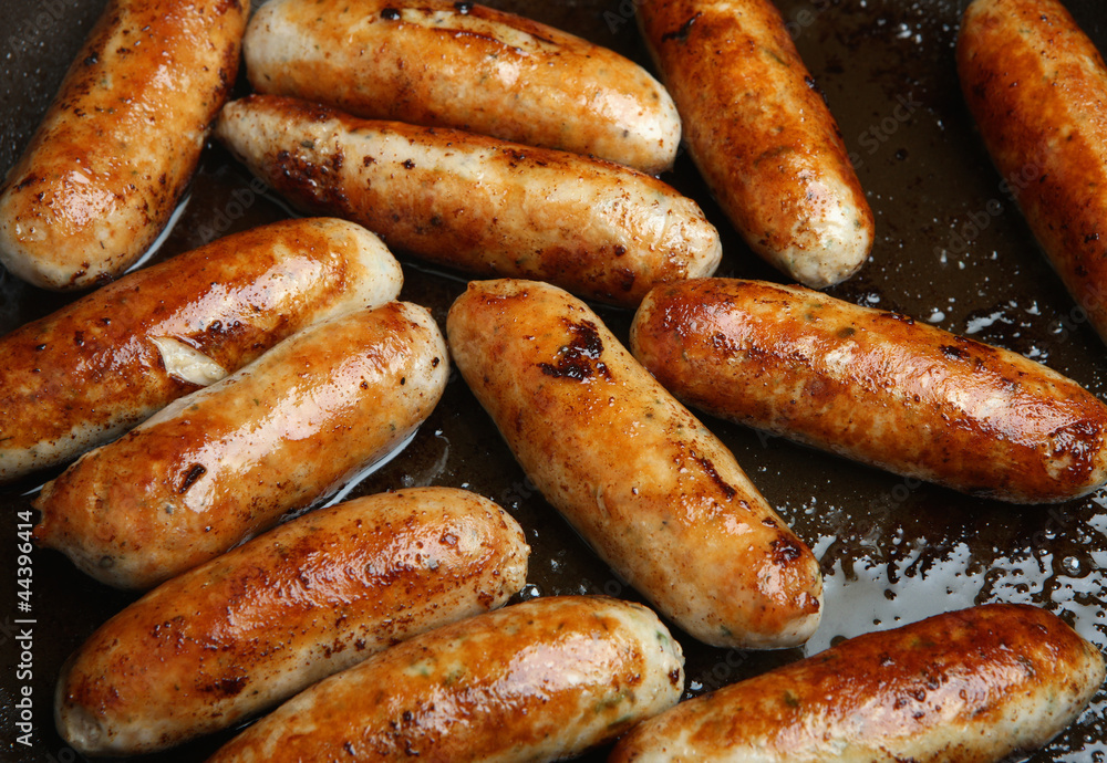 Sausages Cooking in Frying Pan
