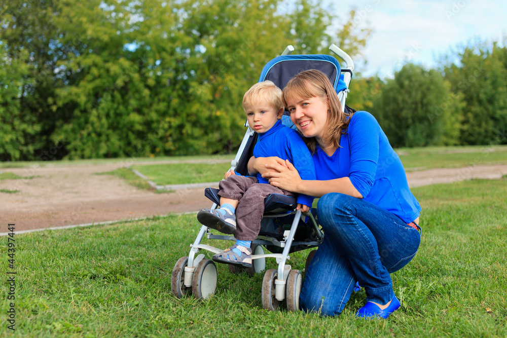 mother and baby in stroller mother and baby in stroller