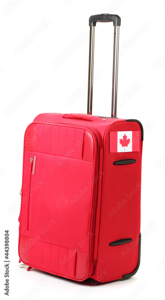 red suitcase with sticker with flag of Canada isolated on white red suitcase with sticker with flag of Canada isolated on white