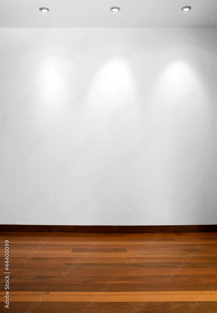 Obraz premium Empty white wall with 3 spot lights and wooden floor