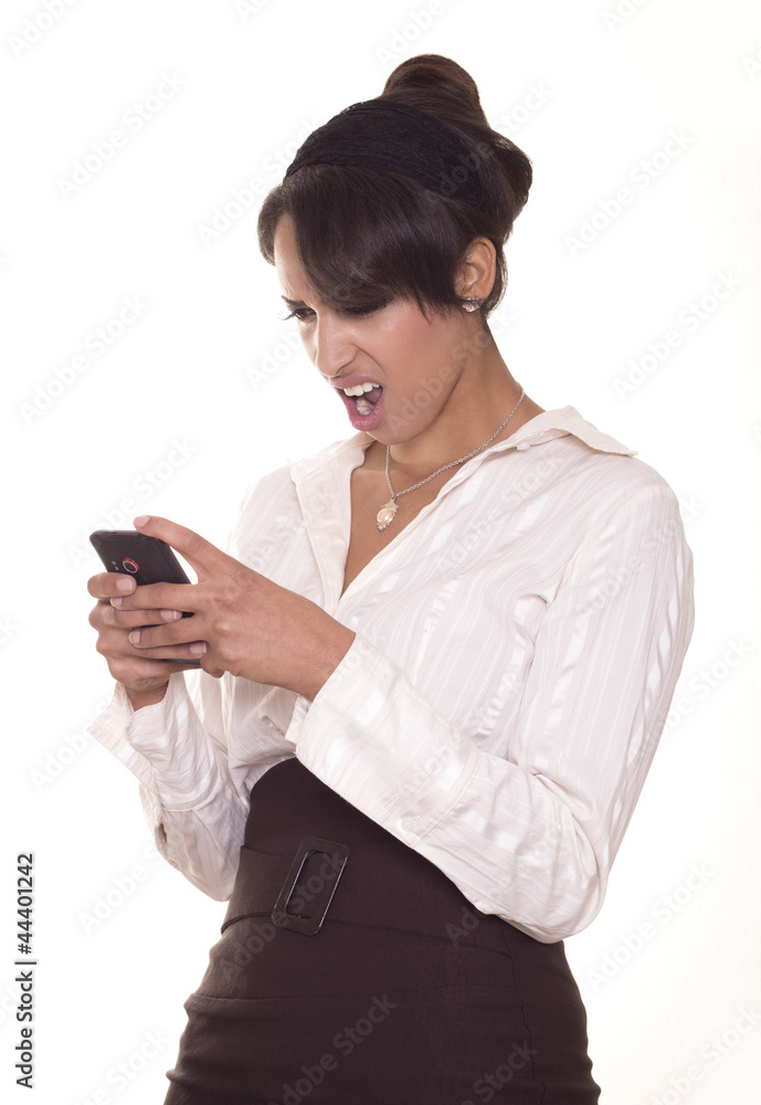 Attractive woman is offended by something on her cell phone. Attractive woman is offended by something on her cell phone.
