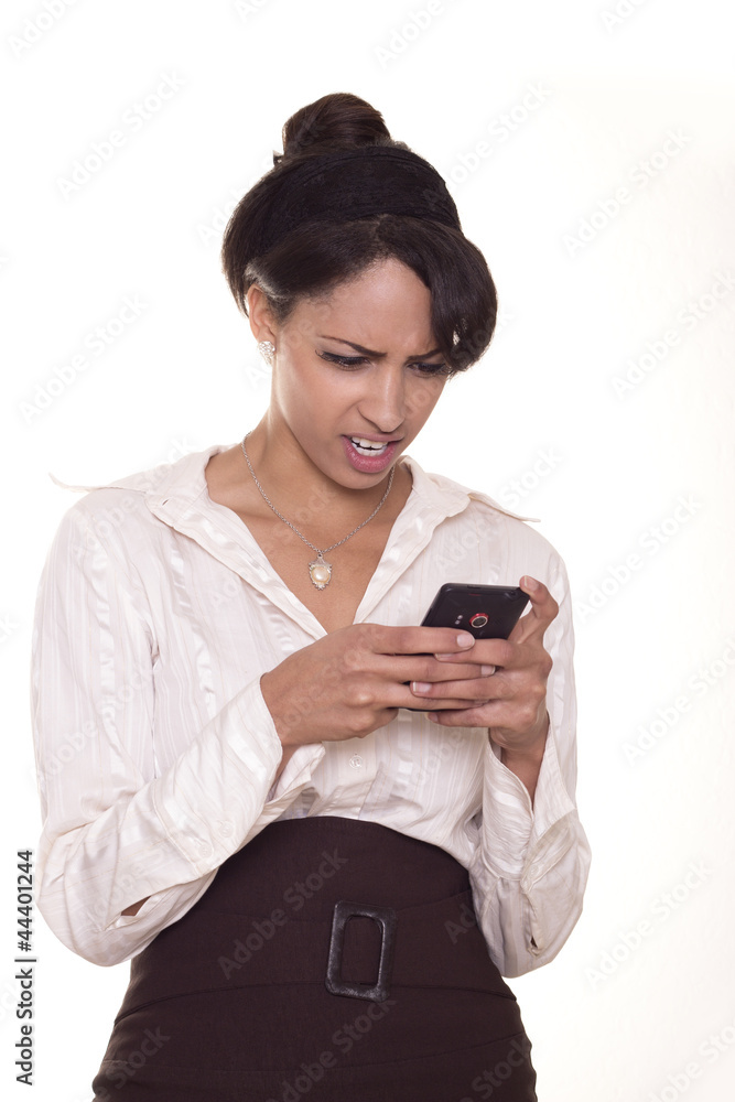 Young business women is confused during texting. Young business women is confused during texting.