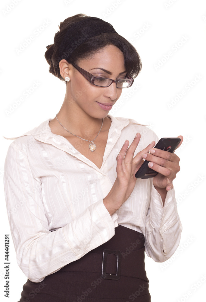Young business woman smiles while using her phone. Young business woman smiles while using her phone.