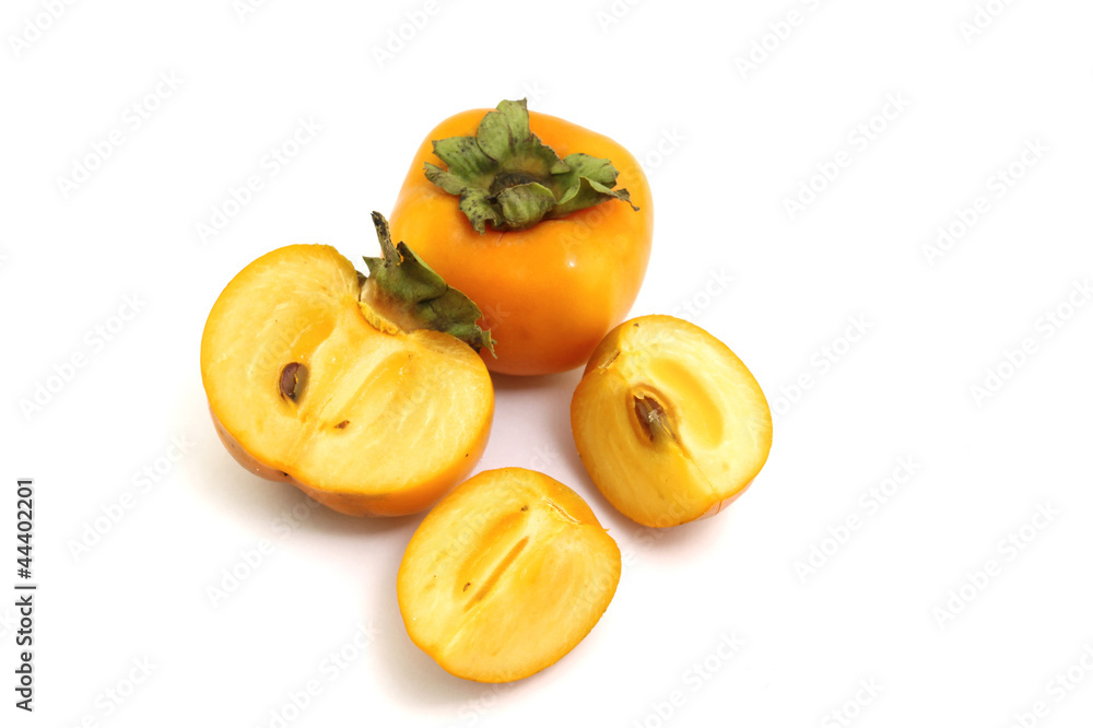 Half of persimmon fruits on white background