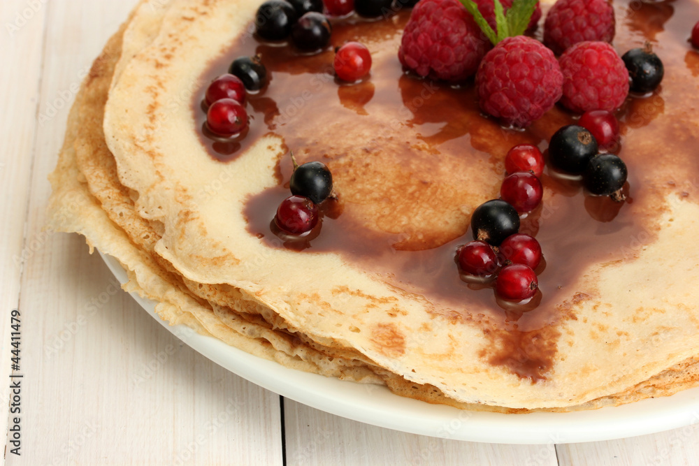 Delicious pancakes with berries and chocolate Delicious pancakes with berries and chocolate