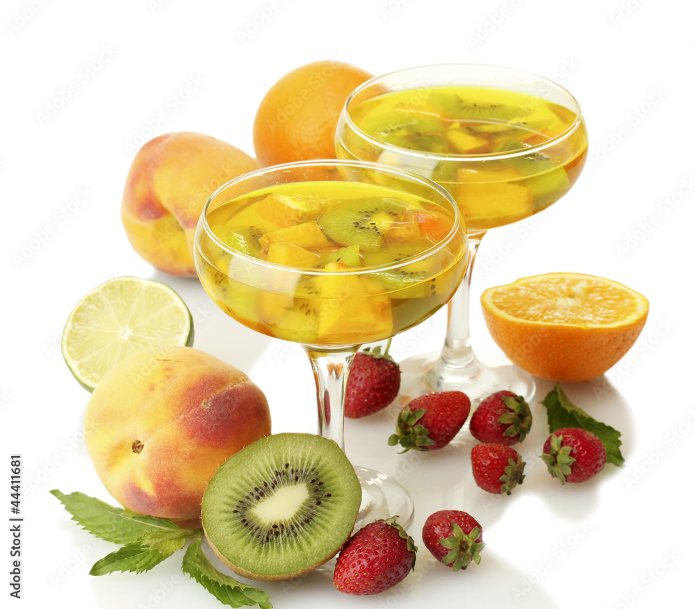 punch in glasses with fruits, isolated on white