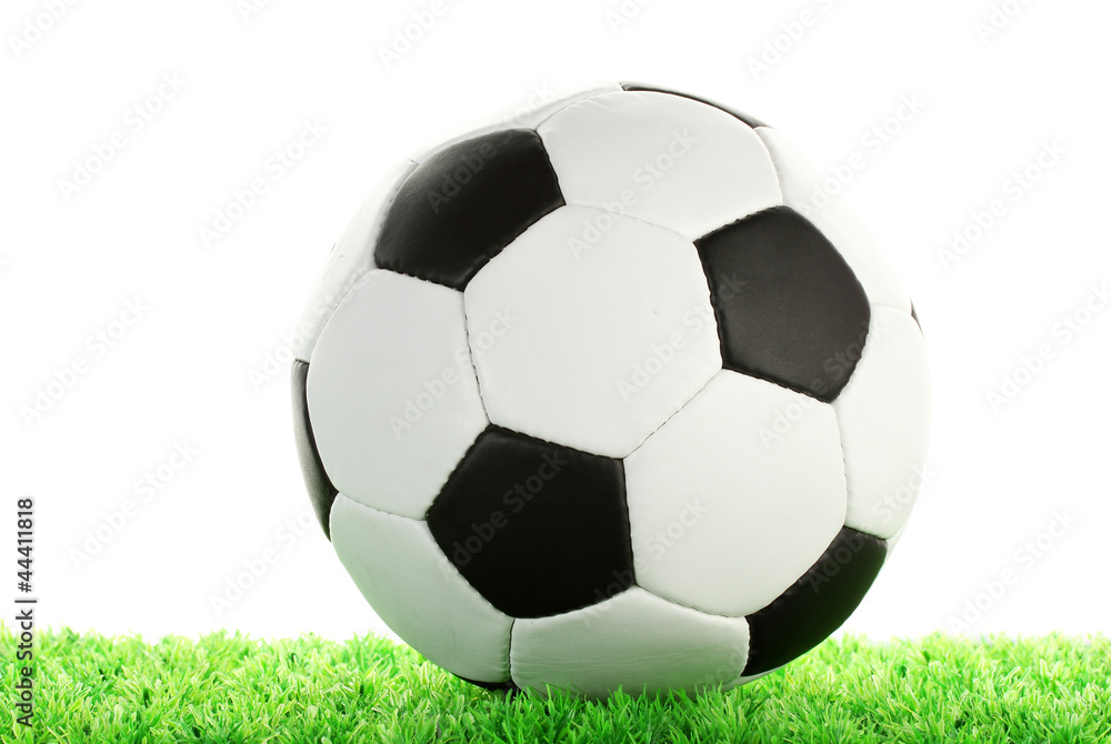 Obraz premium football ball on green grass, isolated on white