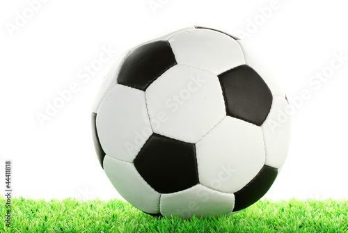 football ball on green grass  isolated on white