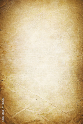 Vintage folded and torn old paper. Grunge classic background