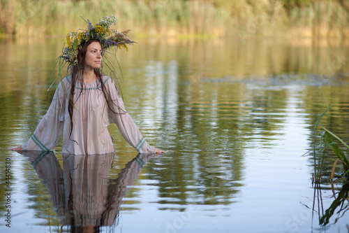 girl in traditional clothes in the river © Vitalfoto
