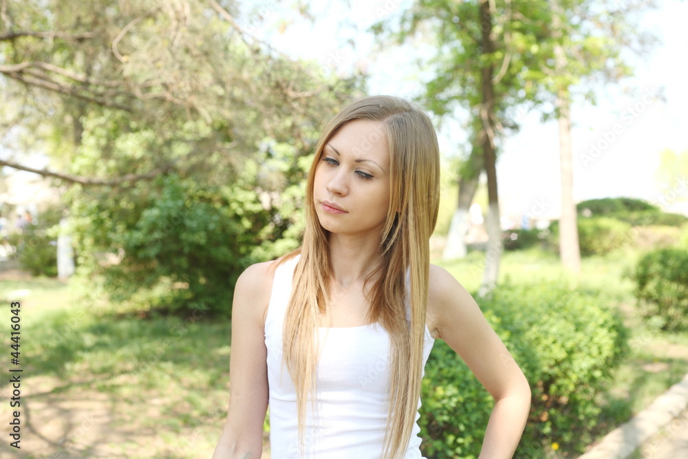 Portrait of sweet young woman enjoying at the park Portrait of sweet young woman enjoying at the park