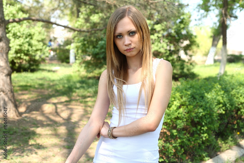 Portrait of sweet young woman enjoying at the park Portrait of sweet young woman enjoying at the park