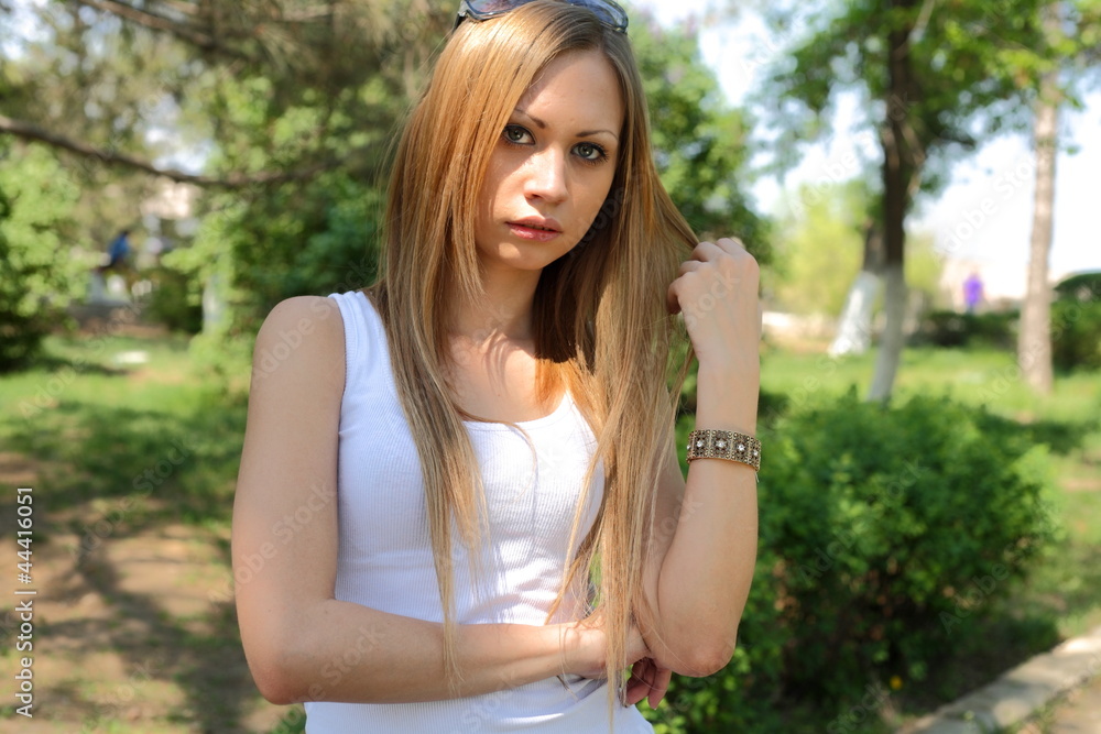Portrait of sweet young woman enjoying at the park Portrait of sweet young woman enjoying at the park