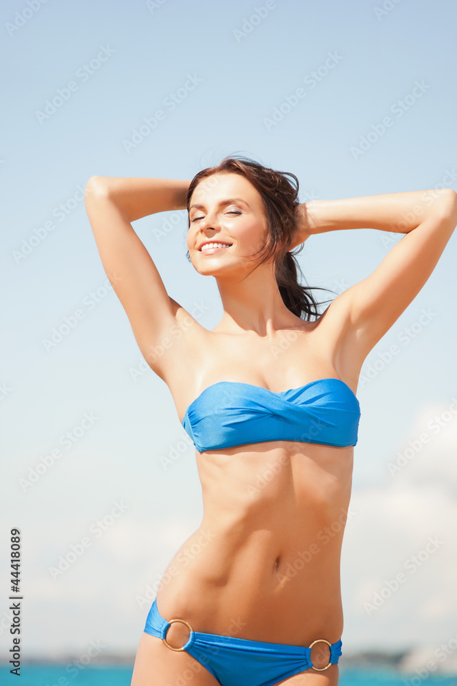 happy smiling woman on the beach