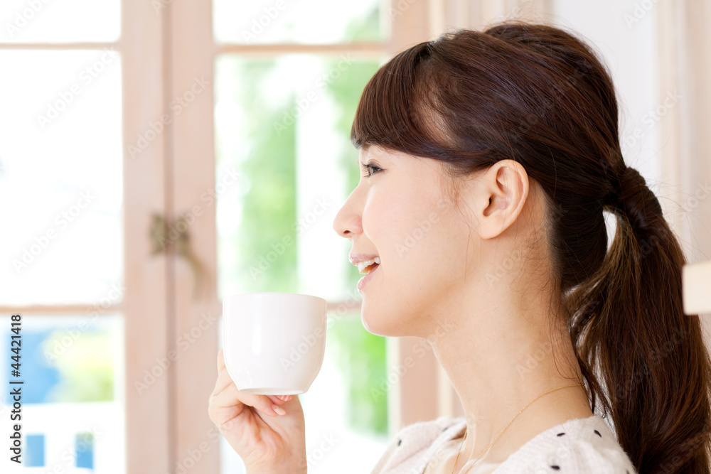 Beautiful young woman drinking coffee. Portrait of asian. Beautiful young woman drinking coffee. Portrait of asian.