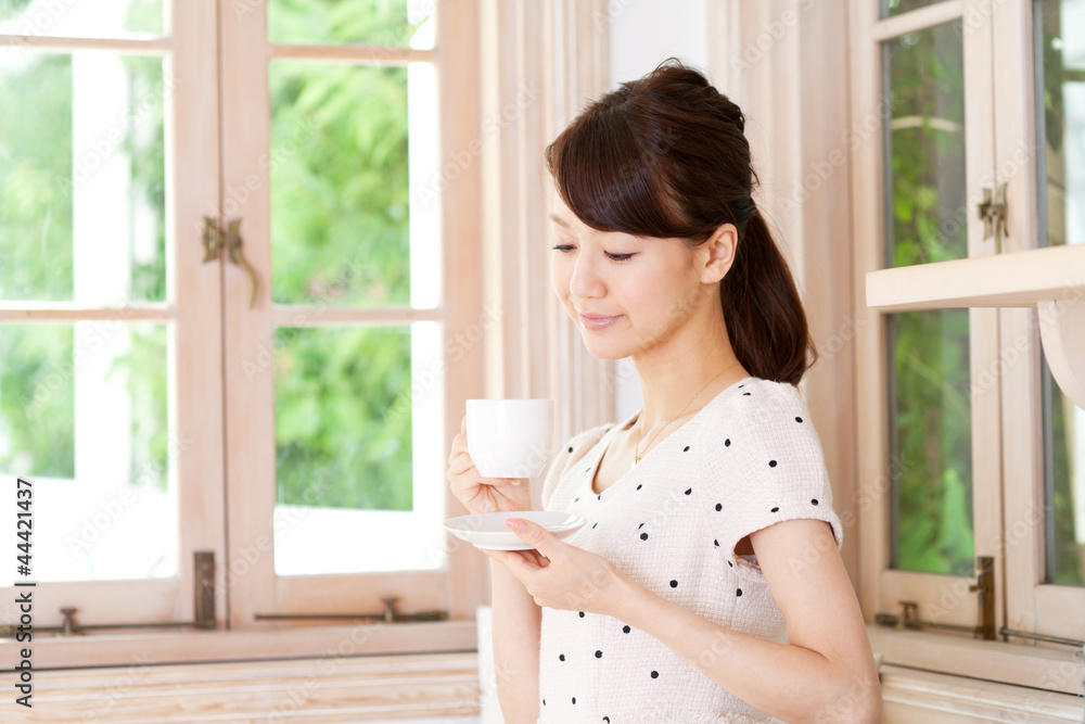Beautiful young woman drinking coffee. Portrait of asian. Beautiful young woman drinking coffee. Portrait of asian.