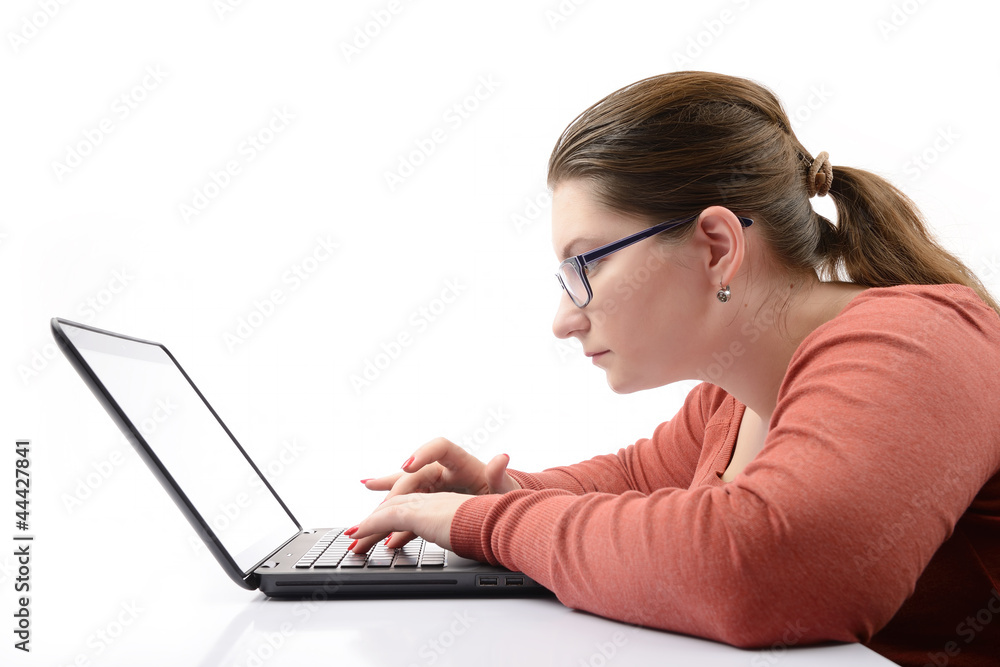 Young girl with a laptop on white background Young girl with a laptop on white background