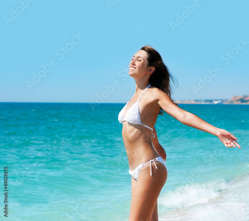 Young Smiling Brunette Woman at the Beach