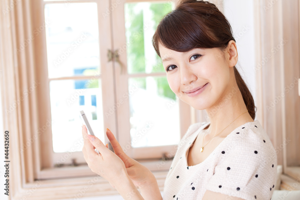 Beautiful young woman using a mobile phone. Portrait of asian. Beautiful young woman using a mobile phone. Portrait of asian.