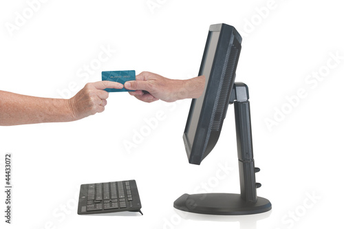 Hand from a monitor grabs user credit card