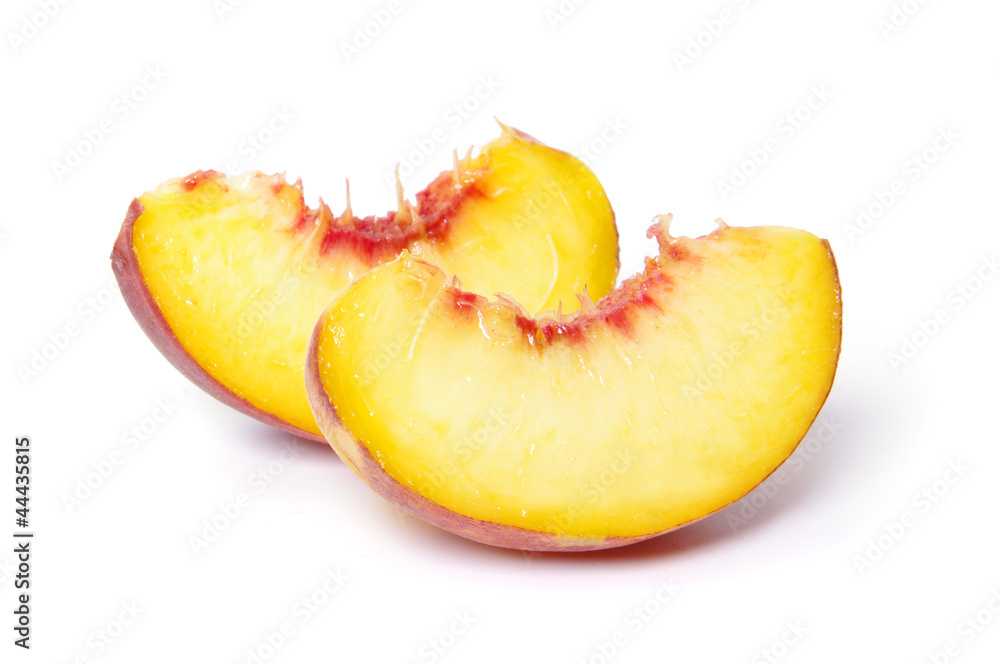 slices of peach on white background